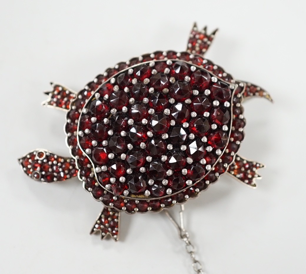 A late Victorian gold plated and pave set garnet tortoise brooch